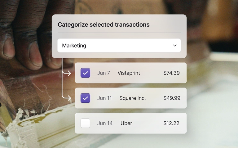 Bulk transaction categorization screen showing selected expenses assigned to the Marketing category.